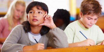 Writing can be Hard! Two upper grade writers. One stuck for what to say and one enjoying the chance to compose.